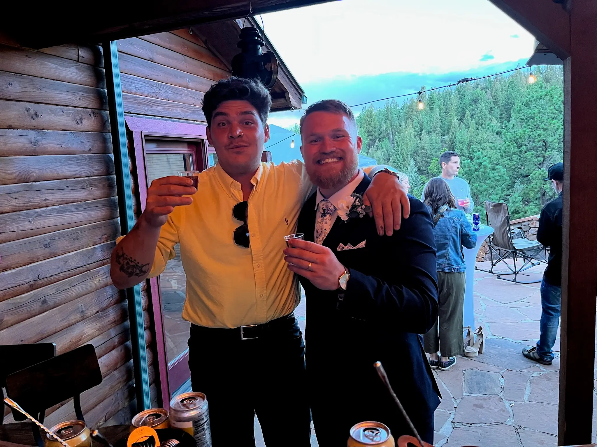 Groom and Family enjoying a drink during a wedding reception at a private residence in Bailey Colorado