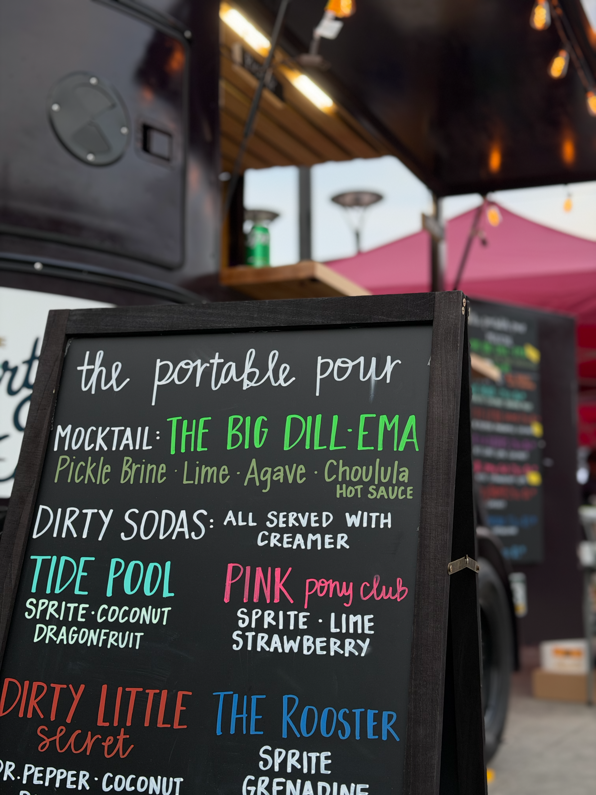 The Portable Pour chalkboard menu at an event